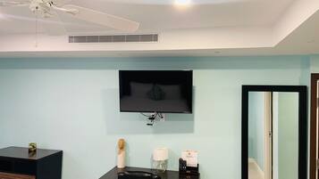 Desk, laptop workspace, blackout drapes, iron/ironing board