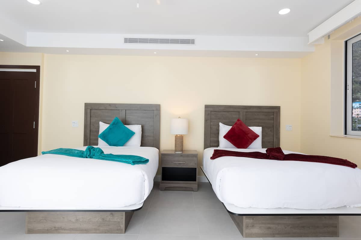 deluxe double room, partial sea view | desk, laptop workspace, blackout curtains, iron/ironing board