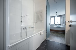 Bathtub, hair dryer, towels, soap