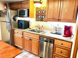 Fridge, microwave, dishwasher, coffee/tea maker - Private, Spacious Basement Suite - Hot Tub, Kitchenette, Ping Pong, Kid-friendly (Colorado Springs)