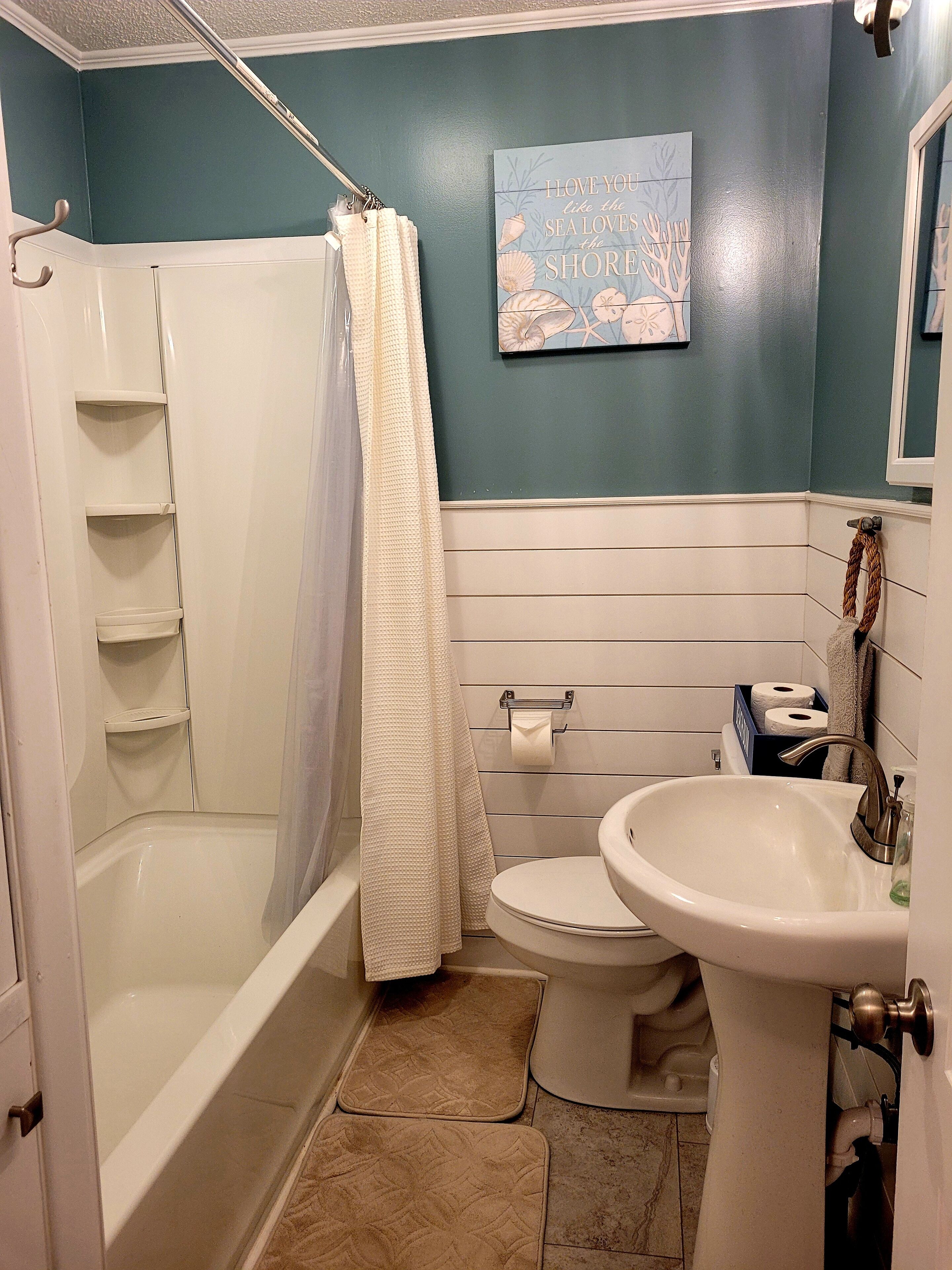Combined shower/tub, hair dryer, towels, soap