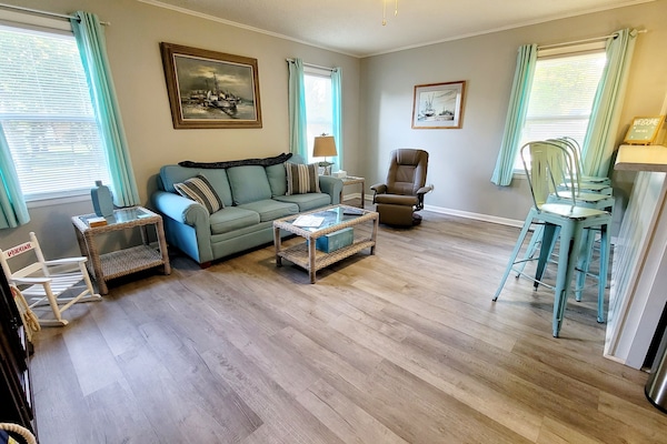 Living room with 50in SmartTV and soft leather recliner