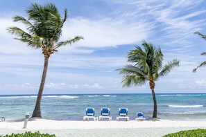 On the beach, sun loungers, beach towels