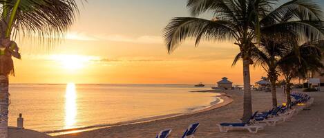 On the beach, sun-loungers, beach towels