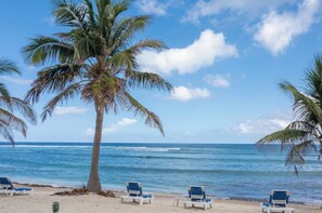 On the beach, sun loungers, beach towels