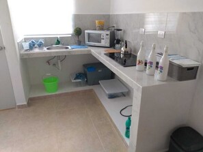 Fridge, microwave, stovetop, coffee/tea maker