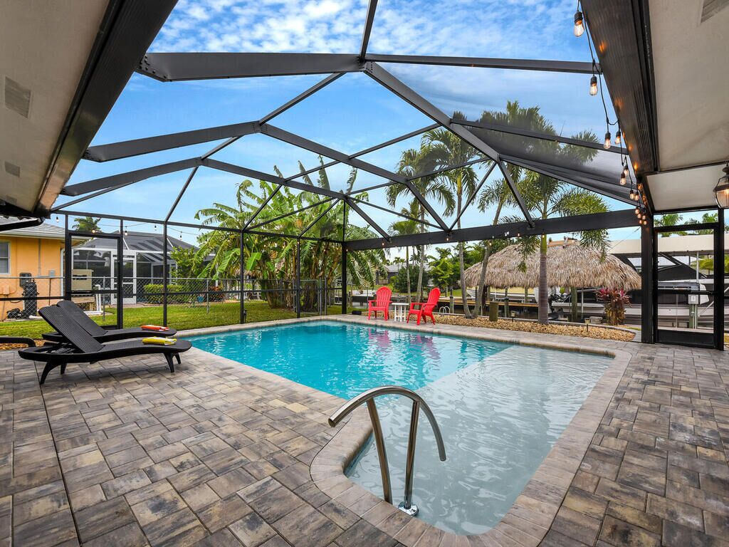 Spacious Home In Prime Pelican Location! Relaxing Lanai with Pool & Tiki Hut