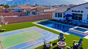 A residential area with a swimming pool, a basketball court, and a fire pit. - Specials-ask +gameroom+basketball+fire pit+bbq+beautiful pool+spa+mountain views (Desert Hot Springs)