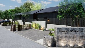 A modern building with a sign reading "AVA SAUNA & VILLA". - LAVA SAUNA & VILLA (Hachijo)