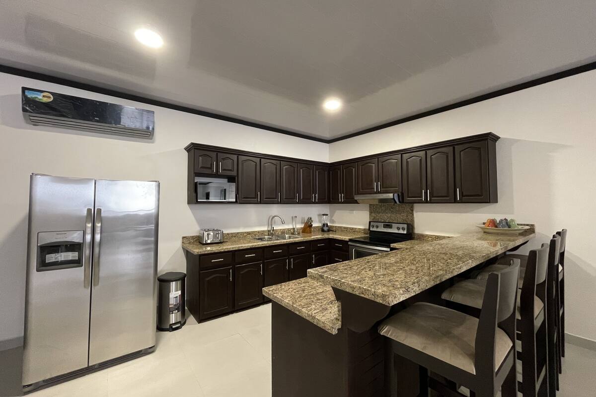 Family Condo | Private kitchen | Full-sized fridge, microwave, oven, stovetop