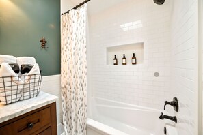 Combined shower/tub, hair dryer, towels, soap