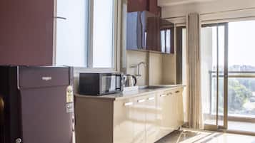 Luxury Apartment | Private kitchen | Fridge, microwave, stovetop, cookware/dishes/utensils