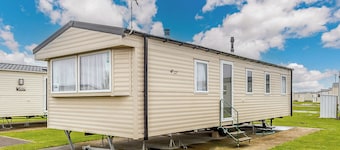 Comfortable modern 12ft-wide caravan with one double and two twin.