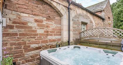 Traditional and stylish converted two storey historic coach house.