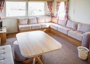 Living area - Quality 12ft-wide caravan with one double and two twin. (Mablethorpe)