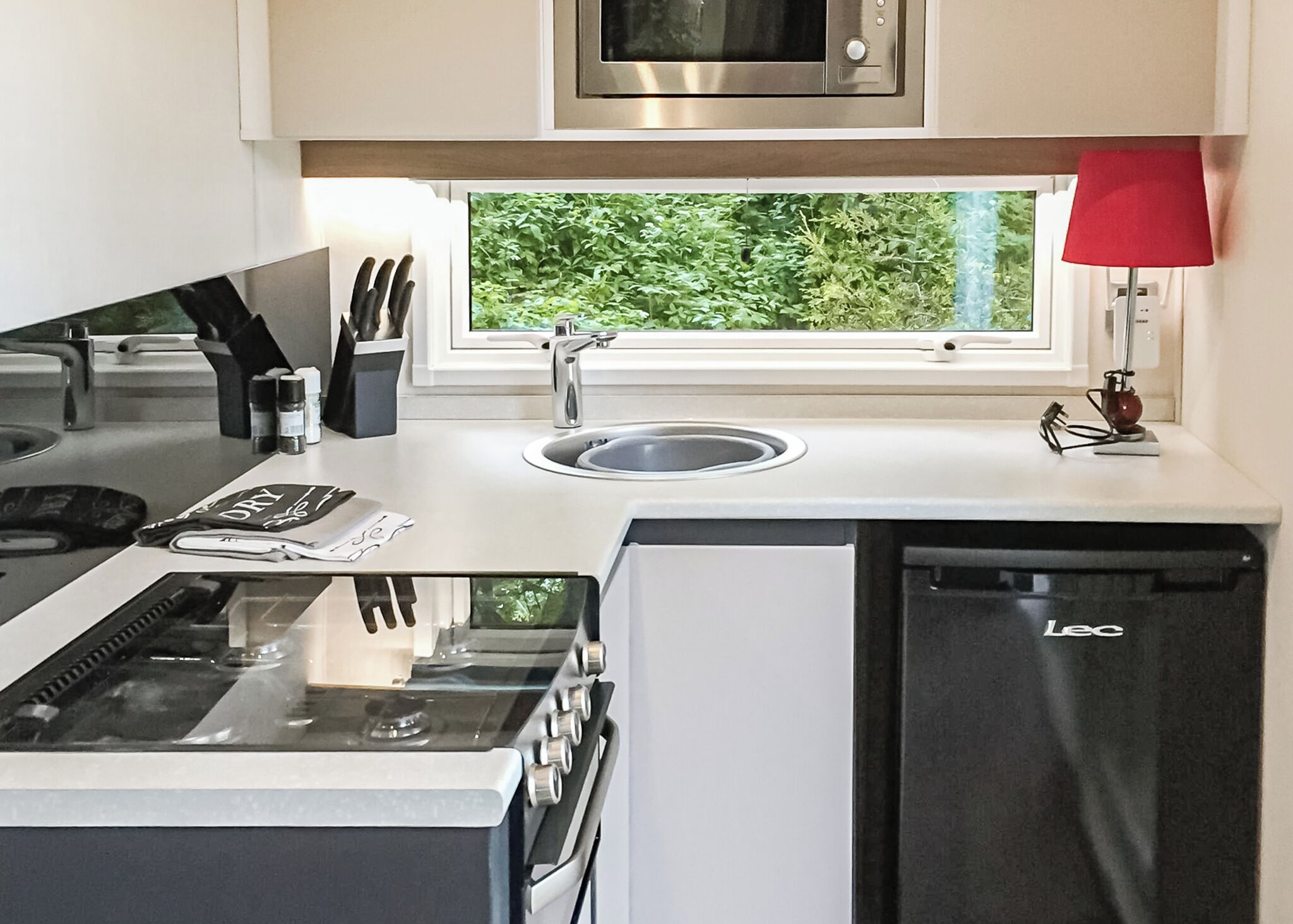 Fridge, toaster, high chair, cookware/dishes/utensils