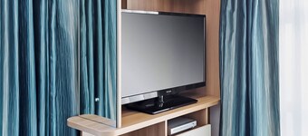 Contemporary mini pod with one double pull-out bed and en suite shower and W.