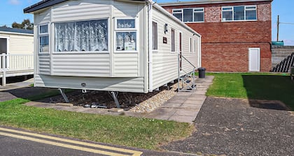 12ft-wide stylish and comfortable caravan with one double and two twin.