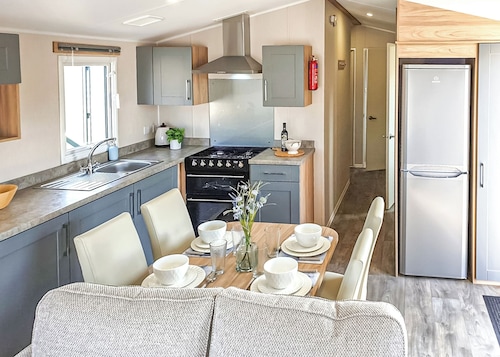 12ft-wide stylish and comfortable caravan with one double and two twin.