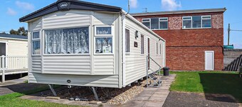 12ft-wide stylish and comfortable caravan with one double and two twin.