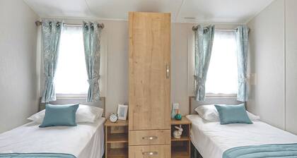 12ft-wide stylish and comfortable caravan with one double and one twin.