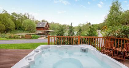 Spacious, light, all wood luxury lodge in tranquil location at head of lake.