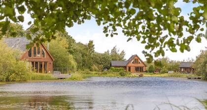 Spacious, light, all wood luxury lodge in tranquil location at head of lake.