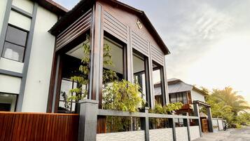 Stylish entrance with a spacious balcony and large windows.