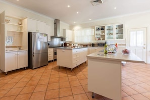 Coffee/tea maker, fridge, microwave, oven