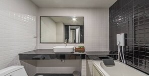 Separate tub and shower, rainfall showerhead, free toiletries