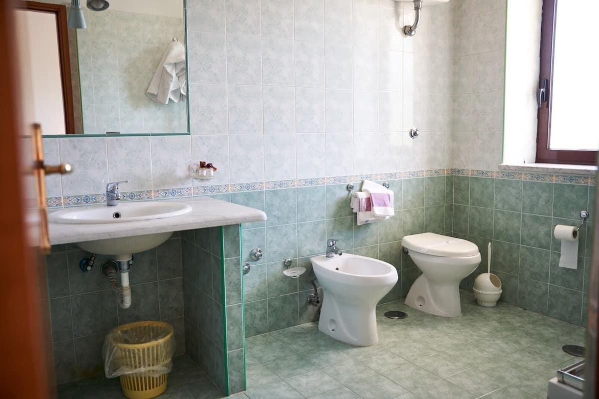 Bathroom | Designer toiletries, hair dryer, bathrobes, slippers