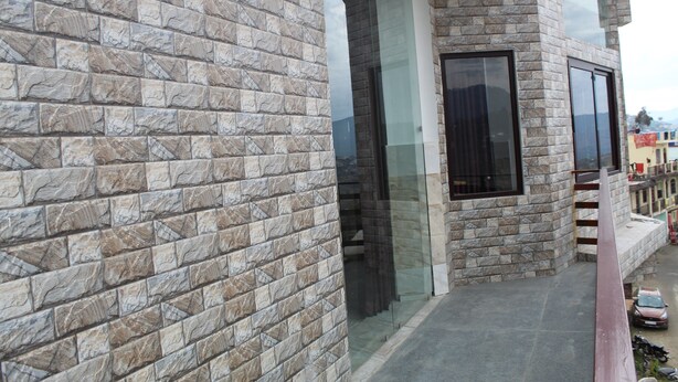 A building with stone facade and large windows. - Jalal Palace (Almora)