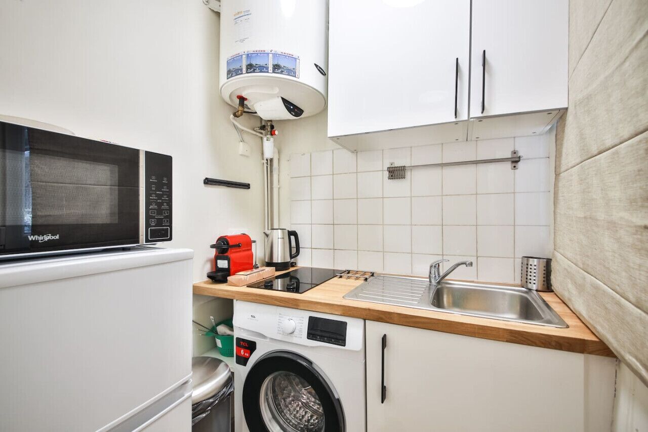 Fridge, microwave, coffee/tea maker, cookware/dishes/utensils