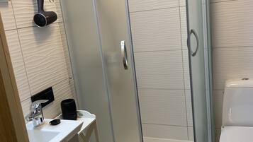 Shower, towels, soap, toilet paper