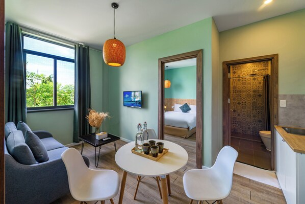 Family Suite, 2 Bedrooms | Living area | 32-inch Smart TV with cable channels, TV