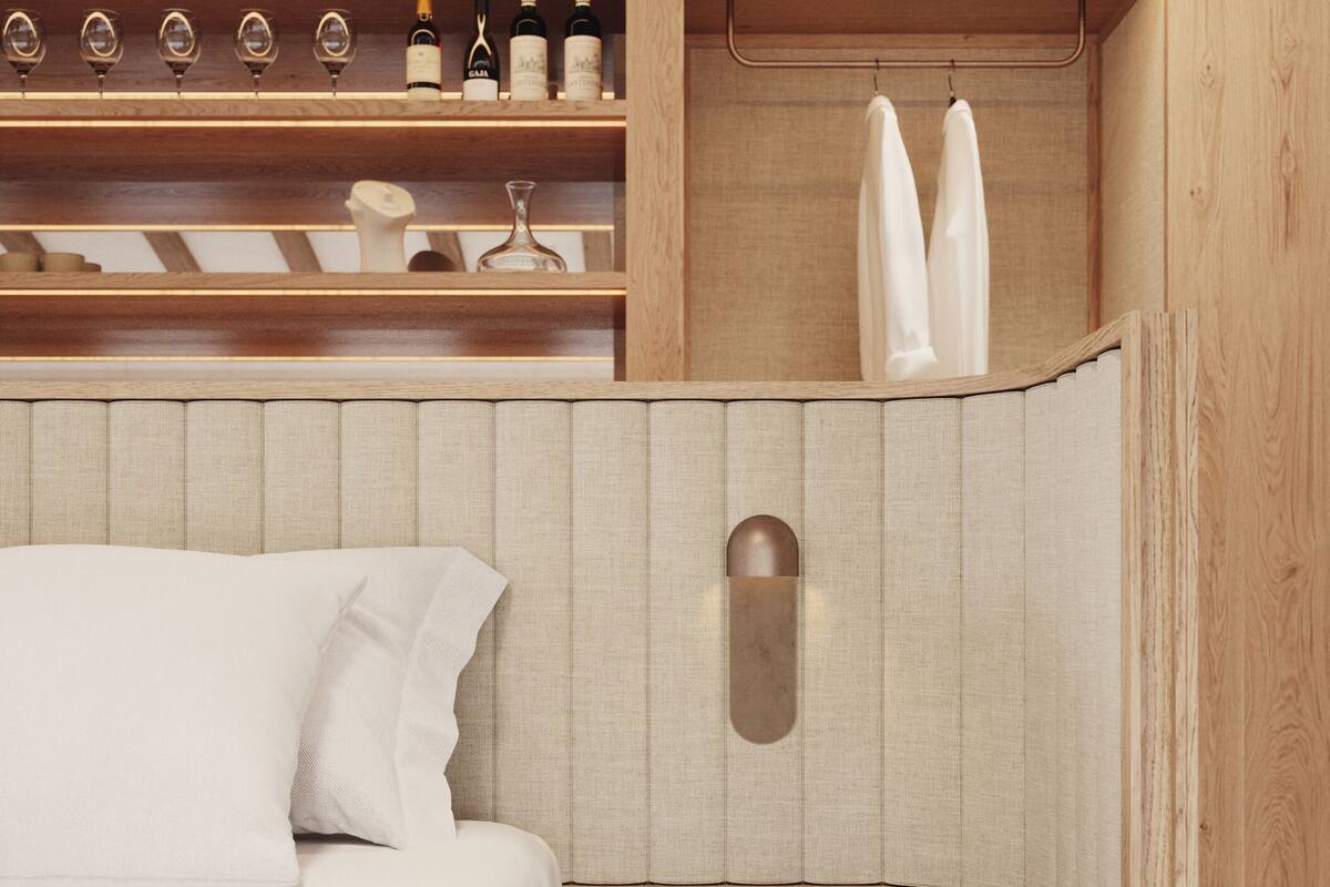 A bedroom with a bed, a bedside table, a wooden wardrobe with shelves, and a hanging rack.