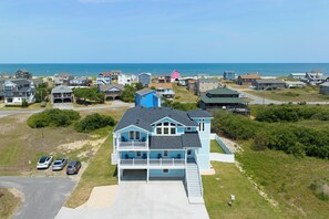 Enjoy a scenic view from the upper balcony, overlooking the surrounding neighborhood and nearby water.