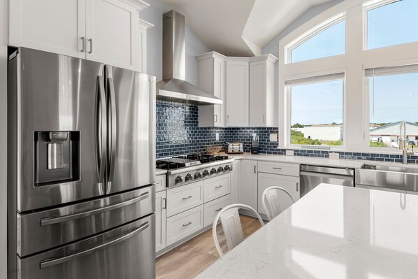Enjoy meals in the kitchen with a dining area and large windows offering views of the surrounding area.