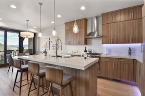 Luxury Townhome | Private kitchen | Coffee/tea maker, dining tables