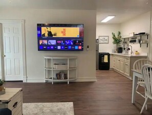 Relax and unwind in this cozy living space, featuring a flat-screen TV and comfortable seating area.