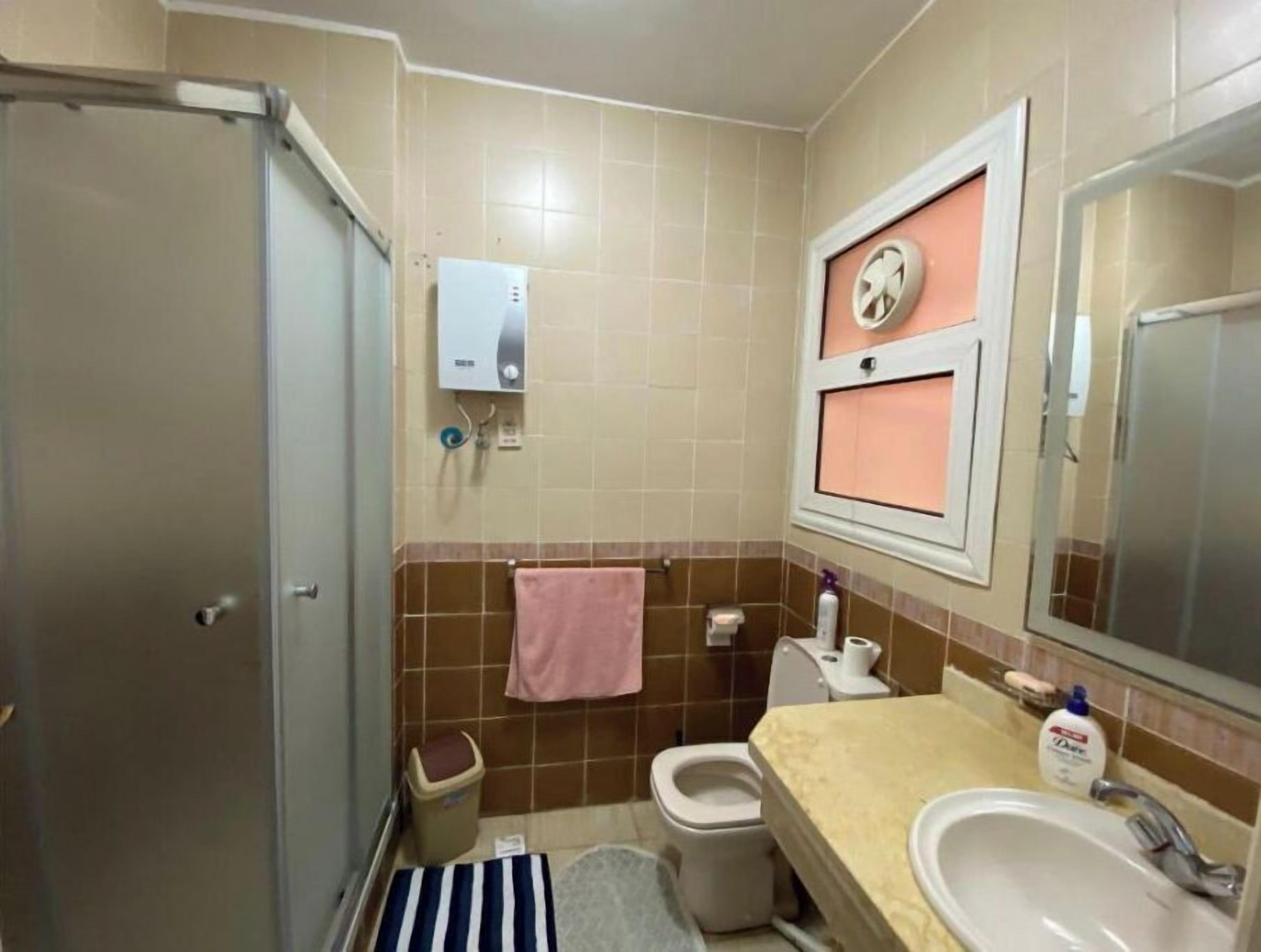 Shower, towels, soap, toilet paper