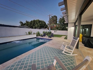 A swimming pool with lounge chairs and a patterned rug. - ARCADIA NEW BUILD-5 BED/4.5 BATH-PRIME LOCATION (Phoenix)