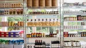 A store with shelves stocked with jars, bottles, and boxes of various food products. - Motel Chelsea (Chelsea)