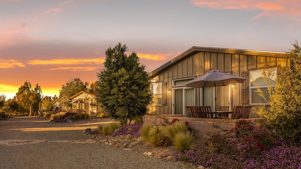 A modern house with a covered patio and outdoor seating. - Ranch House Interior - 4 bedroom, 4 bath home on-site of Galway Downs (Temecula)