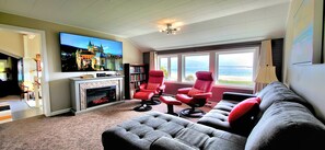 Relax in the 2nd floor living room with 75" TV, fireplace and OMG views!