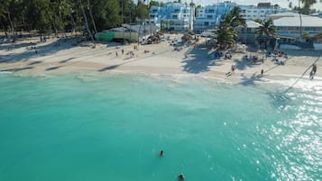 On the beach, sun loungers, beach towels