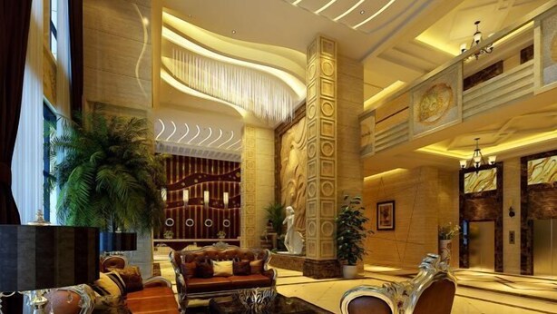 A spacious lobby with a grand reception desk, plush seating, and decorative columns. - Golden Begonia Donggang Hotel Lincang (Lincang)