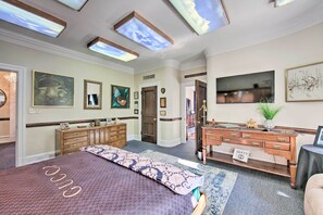 A hotel room with a large bed, a wooden dresser, a television, and artwork on the walls. - 8 Mi to Hersheypark: 'Millard Mansion' in Annville (Annville)