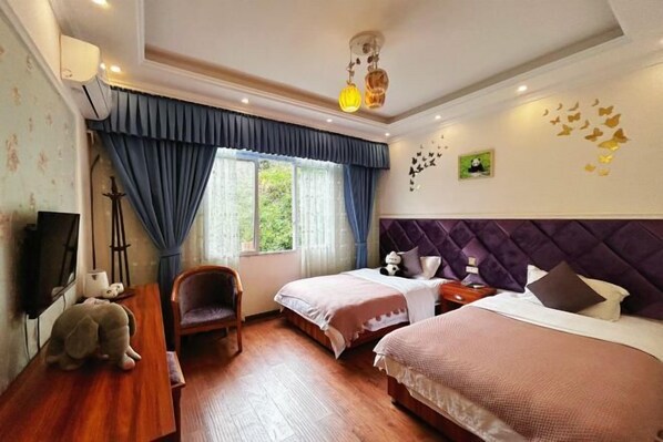 A bedroom with two beds, a wooden desk, a chair, and a window with curtains. - Wenfeng Villa (Ya'an)