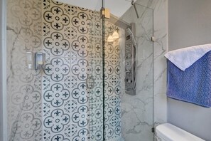 Shower, hair dryer, towels, toilet paper